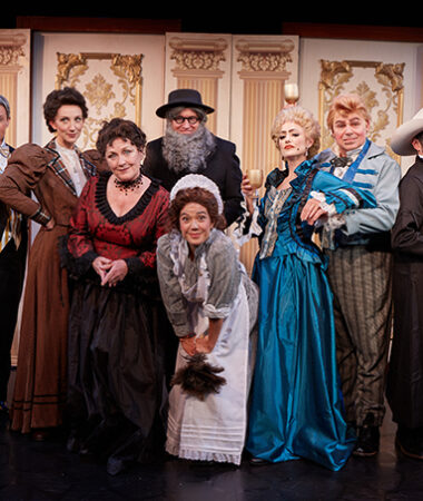 Cast of Holmes_ (L-R) Tony Perry, David McBean, Sharon Rietkerk, Deborah Gilmour Smyth, Katy Tang, Katie Karel, Phil Johnson, Andrew Ableson (Back) Bart Shatto (Holmes in disguise) – photo by Aaron Rumley